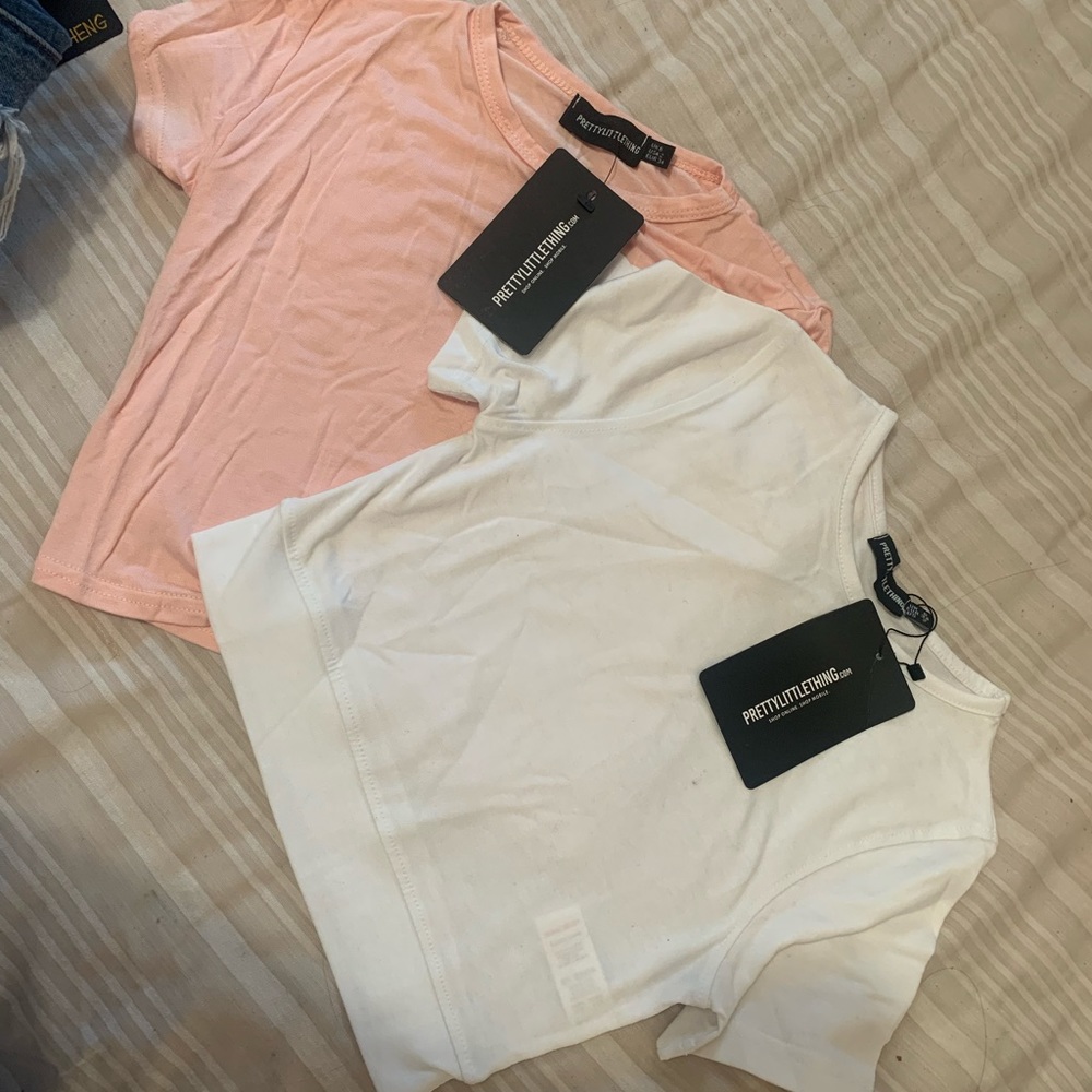 Two PLT baby tees